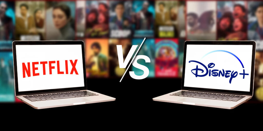 Two laptops display the logos of Netflix and Disney+.