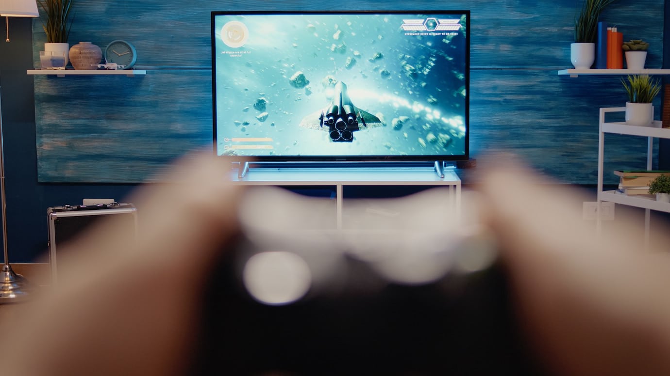 A person holds a game controller.
