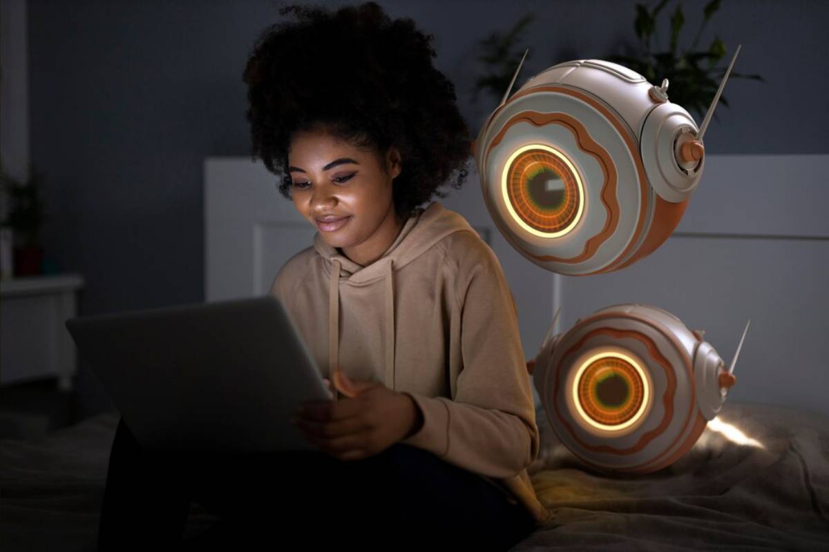 A person sits on a bed, engaged with a tablet.