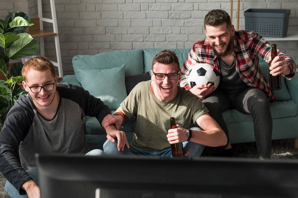Friends enjoying a sports game.