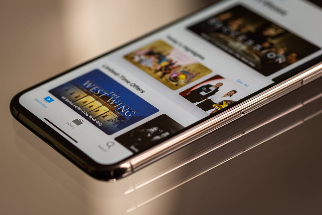 A close-up of a smartphone displaying a streaming service interface